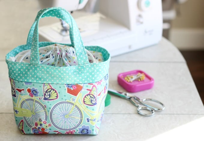 scripture tote on table next to sewing machine