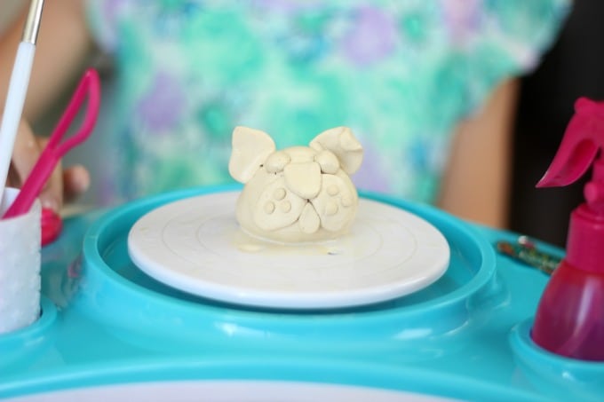 clap puppy on pottery wheel