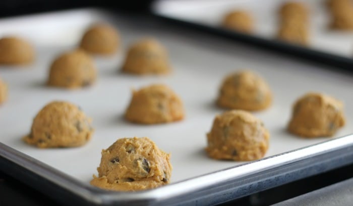 scoops of cookie dough on baking sheet