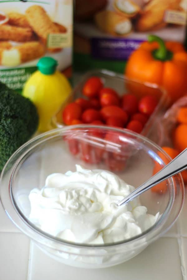 This Thanksgiving Appetizer platter with homemade cool dill dip comes together in about 20 minutes! An orange bell pepper resembles a pumpkin to make this offering even more festive. 