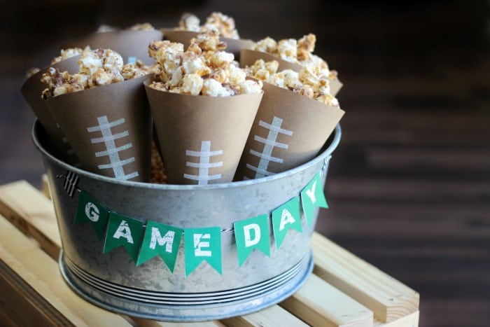 Always a crowd pleaser, this chocolate caramel popcorn is easy to make and very addicting. Make a batch for your next party. Also a simple tutorial for popcorn cones (holders). 