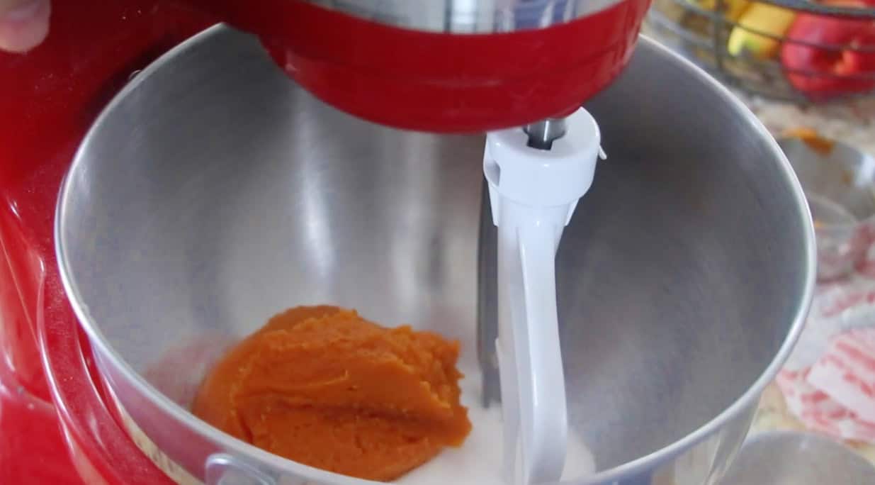 Stand mixer bowl with butter, sugar, egg and pumpkin puree.
