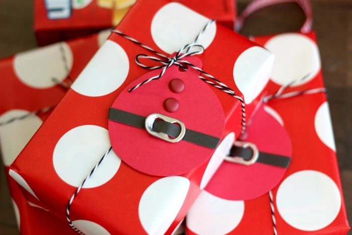 These quick and easy Santa Suit gift tags, made out of cardstock and soda can tabs, are the perfect addition to any gift this holiday season!