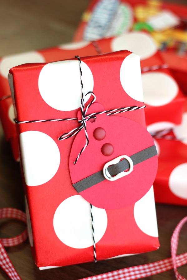 These quick and easy Santa Suit gift tags, made out of cardstock and soda can tabs, are the perfect addition to any gift this holiday season!