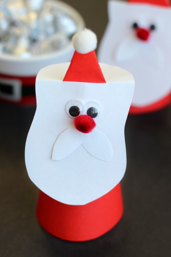 paper cone Santa standing on table