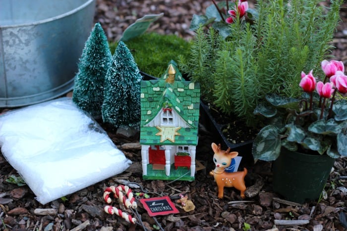 A beautiful Christmas fairy garden to brighten your porch or home this holiday season! Get the kids involved for a magical project that will last all season!