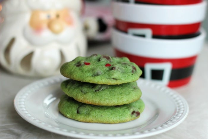 Peppermint extract, chocolate chips, heart sprinkles, and green cookie dough combine to create...GRINCH cookies! These are sure to be a hit at any holiday gathering this year!