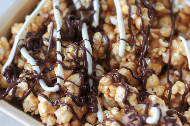 zebra caramel popcorn on baking sheet