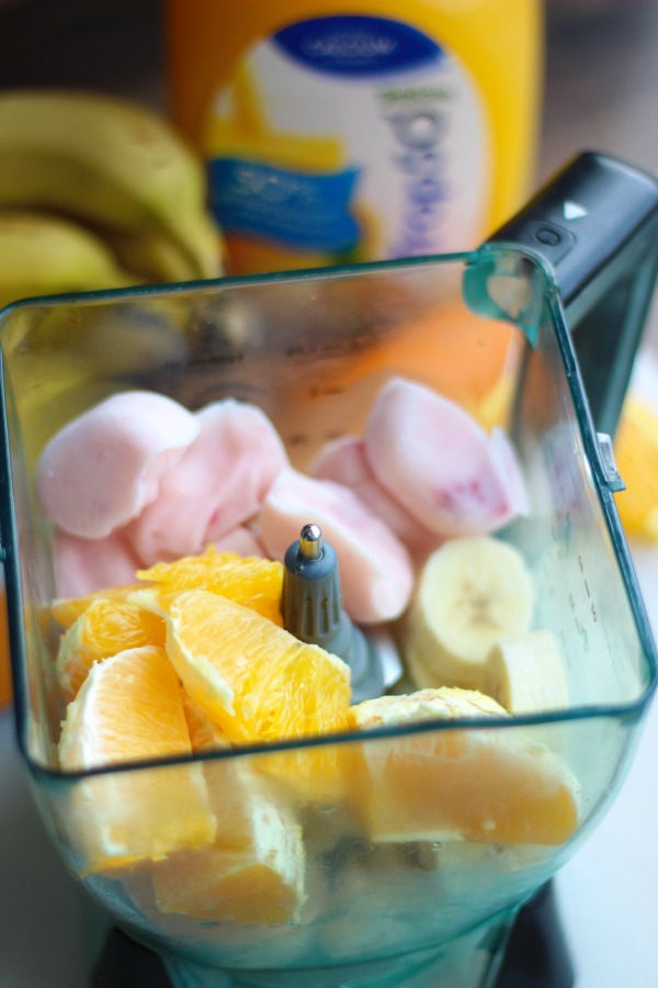 This banana orange breakfast smoothie is the perfect way to start the day. Fresh oranges, frozen strawberry yogurt, frozen bananas and orange juice. 