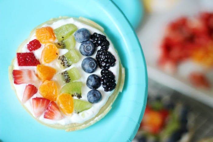 A delicious fruit waffle bar that is as colorful as the rainbow! Fresh fruit, cream, and waffles combine for the perfect St. Patrick's Day breakfast (or dinner!) that the whole family will love. 