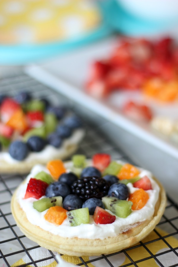 A delicious waffle bar that is as colorful as the rainbow! Fresh fruit, cream, and waffles combine for the perfect St. Patrick's Day breakfast (or dinner!) that the whole family will love. 