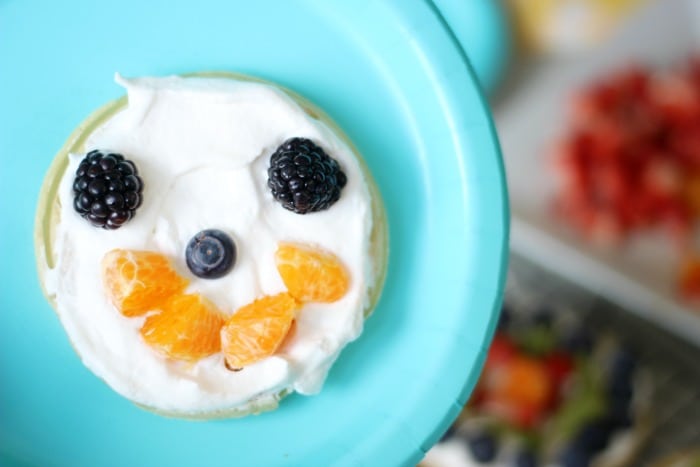 A delicious fruit waffle bar that is as colorful as the rainbow! Fresh fruit, cream, and waffles combine for the perfect St. Patrick's Day breakfast (or dinner!) that the whole family will love. 