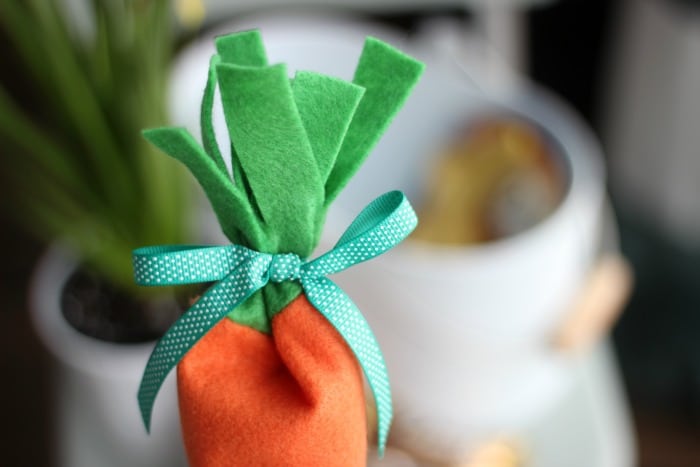 felt carrot candy pouch tied off with green ribbon