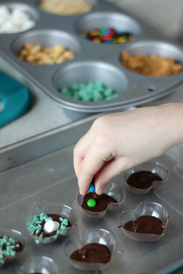 Raid the pantry to see what fun add-ins you can find for your own chocolate candies! Kids love making their own food and these DIY chocolate candies are super easy...and yummy!