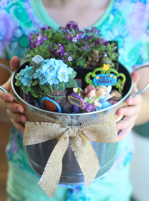 Easy fairy garden ideas for all seasons. Winter, spring, summer and fall inspiration to brighten your home and porch. Make one outdoor, indoors, with plants, with flowers, or with succulents! You can make it in a barrel, a milk jug, a pot, or a tea cup. 