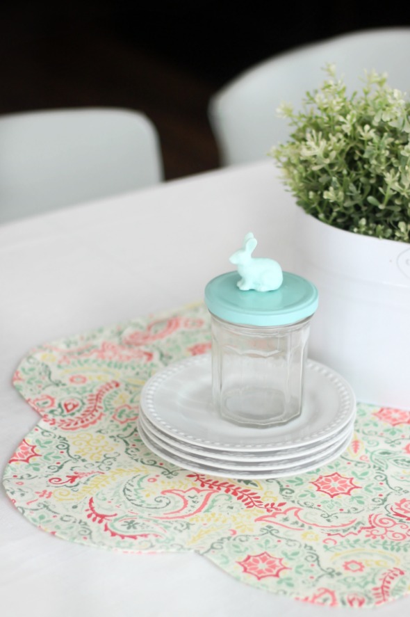 Add a pop of color to your table this spring with a DIY table runner! A quick and easy beginning sewing project. Use coordinating fabrics for a reversible runner!