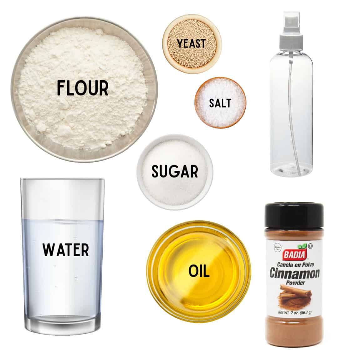 Bowls of flour, yeast, salt, sugar, oil, cup of water, small spray bottle, and bottle of ground cinnamon.