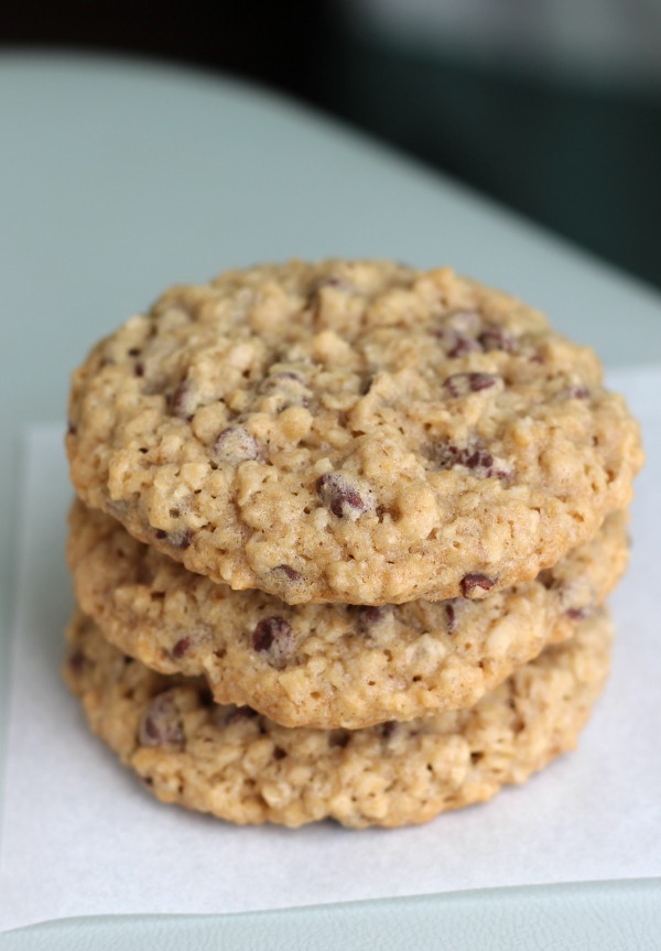 chocolate chip cookies stacked on parchment paper