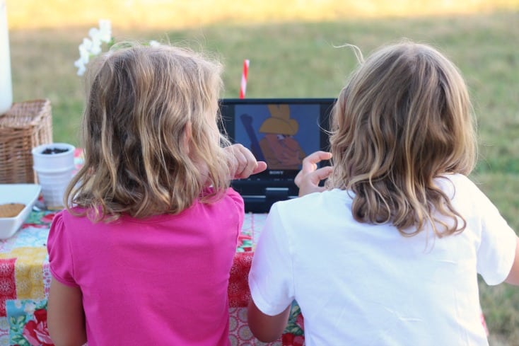 kids watching an out door movie