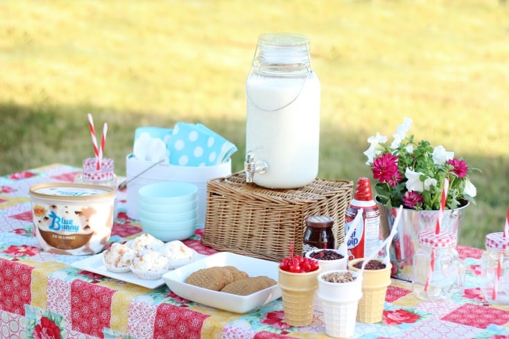ice cream cookie sundae party set up on picnic table
