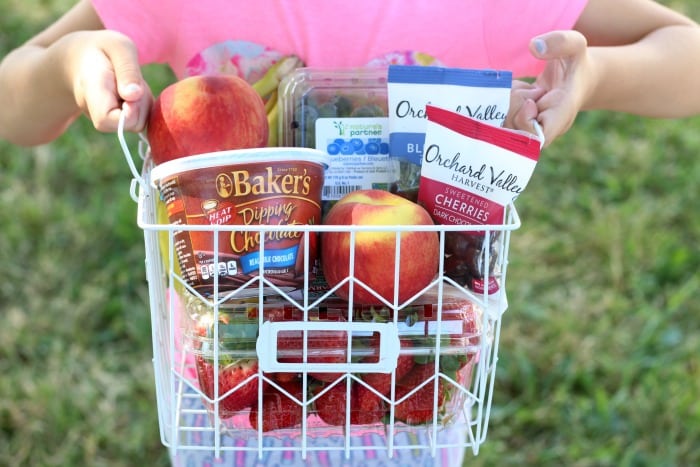 A fresh fruit and chocolate gift basket perfect for summer giving! Not your typical fruit basket either. Strawberries, raspberries, blueberries, bananas & peaches. Tucked inside a basket with dipping chocolate! The perfect gift for a teacher!