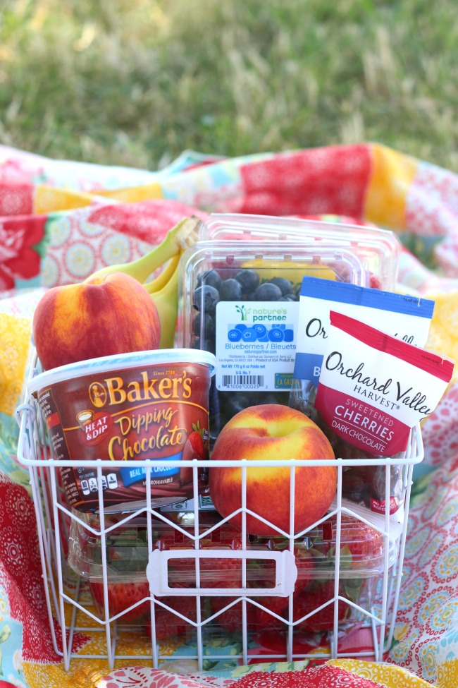 A fresh fruit and chocolate gift basket perfect for summer giving! Not your typical fruit basket either. Strawberries, raspberries, blueberries, bananas & peaches. Tucked inside a basket with dipping chocolate! The perfect gift for a teacher!