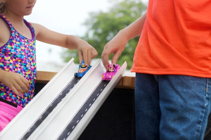 rain gutters cut in half and used as race tracks