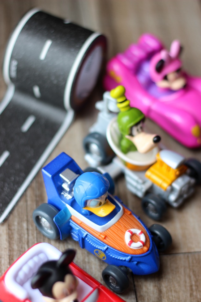 small Disney character cars and road masking tape