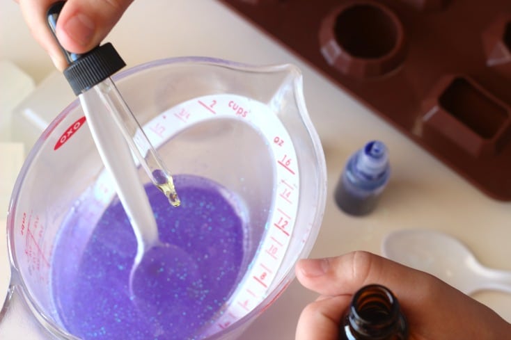 stirring purple soap mixture