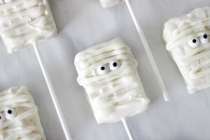 mummy rice krispies treats on parchment paper