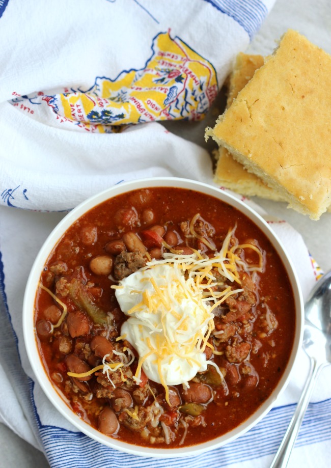 This delicious sausage and turkey chili recipe comes together quickly and simmers in the slow cooker until dinnertime! Tons of flavor without a lot of heat so it's kid-friendly too!