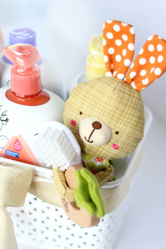A soothing baby bedtime bath kit with everything needed to wind down at the end of the day. A cozy towel, pajamas, a bedtime story, favorite toy, and a variety of soothing baby bath products all tucked inside a nursery basket for easy gift giving and future storage.