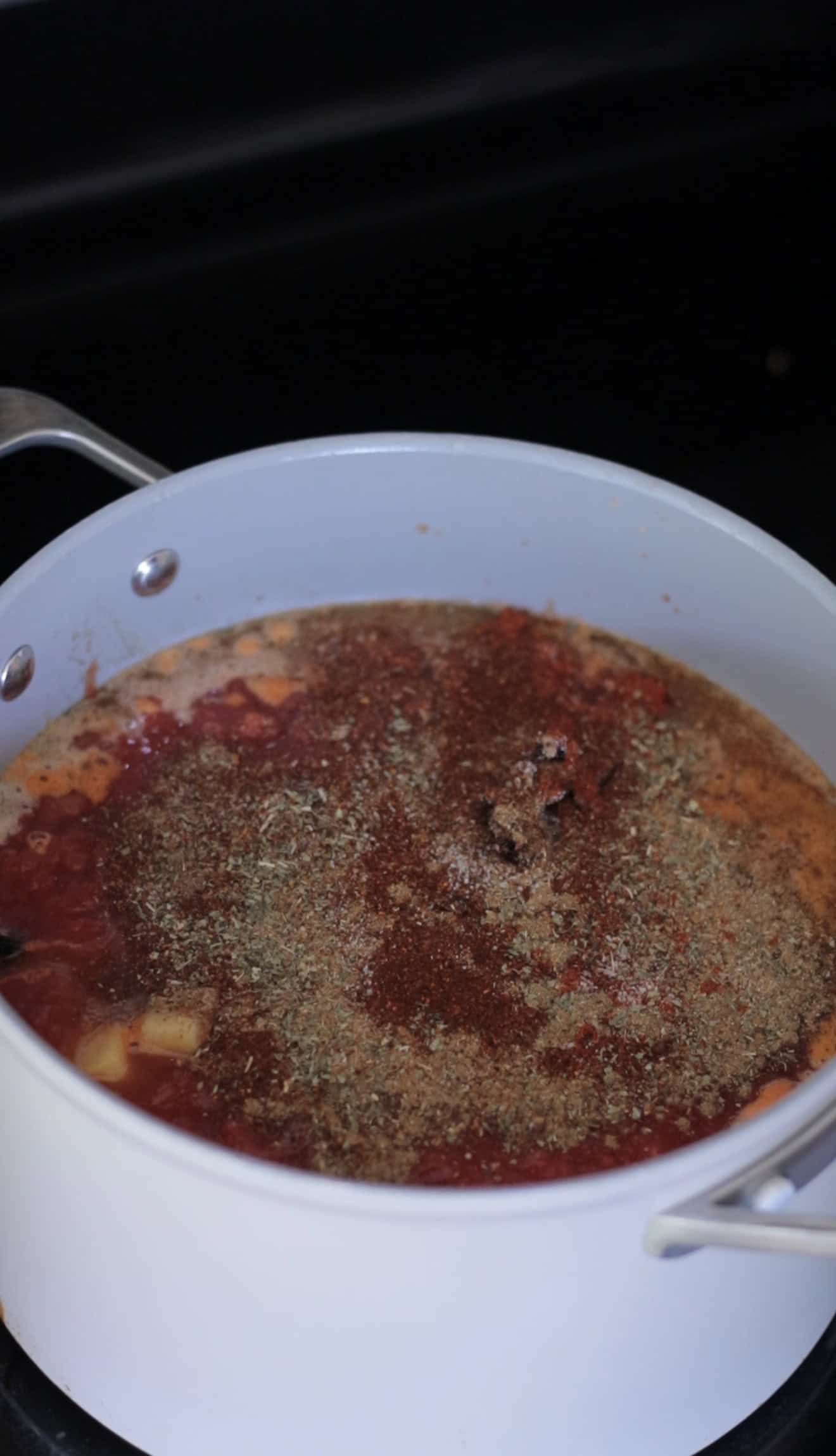 Beans and spices in pot.