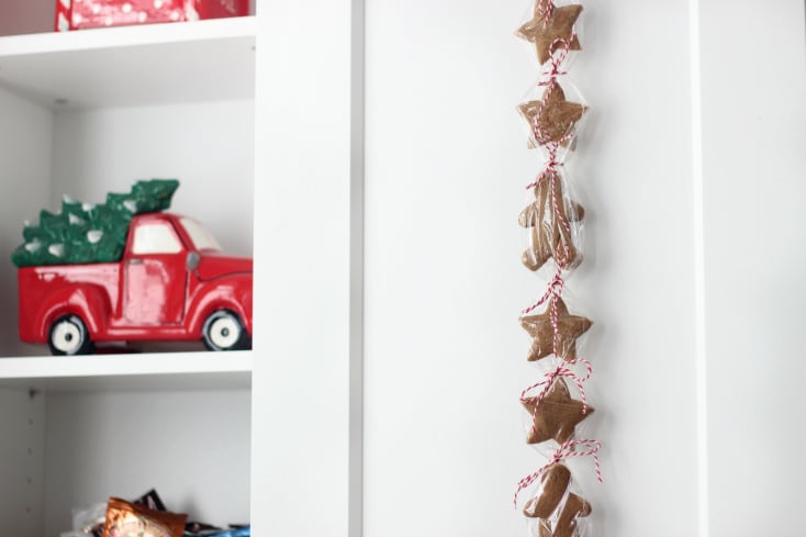 cookies wrapped in plastic wrap, hanging on cabinet