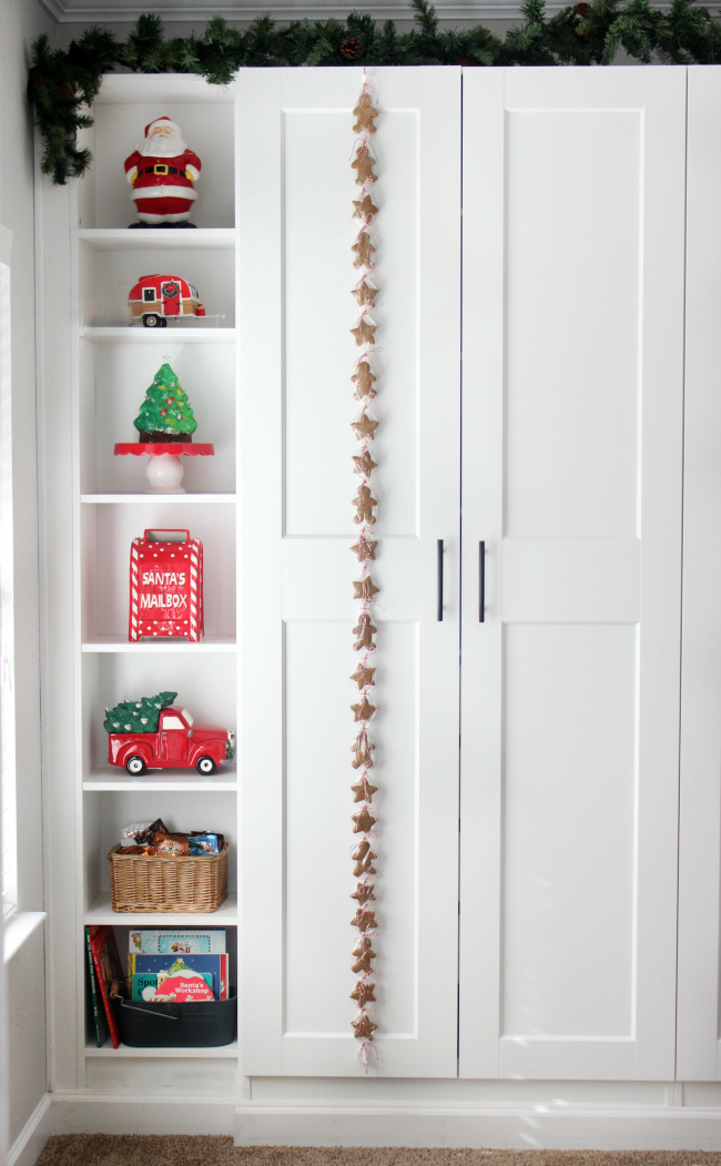 24 cookies wrapped in plastic, hanging on cupboard