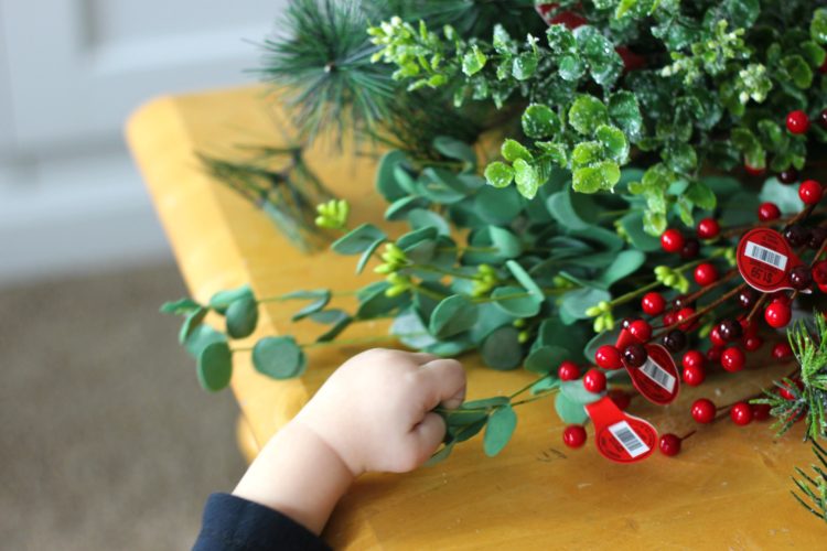 Make a gorgeous winter berry wreath for your front door with a few supplies from your local craft store. An easy to follow wreath tutorial and inexpensive way to add a touch of color and to your home this holiday season! 