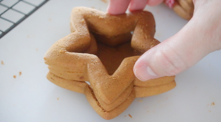 3 star cookies stacked to create gingerbread cookie box