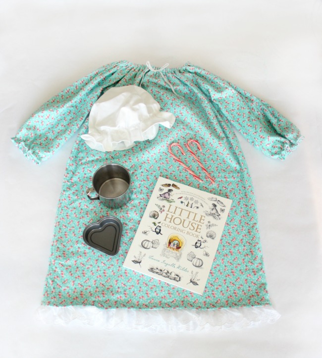 Go back in time with this darling Little House on the Prairie themed Christmas gift! Complete with a soft nightgown, night cap, tin cup, peppermint candy, mini hear pan, and a coin. 