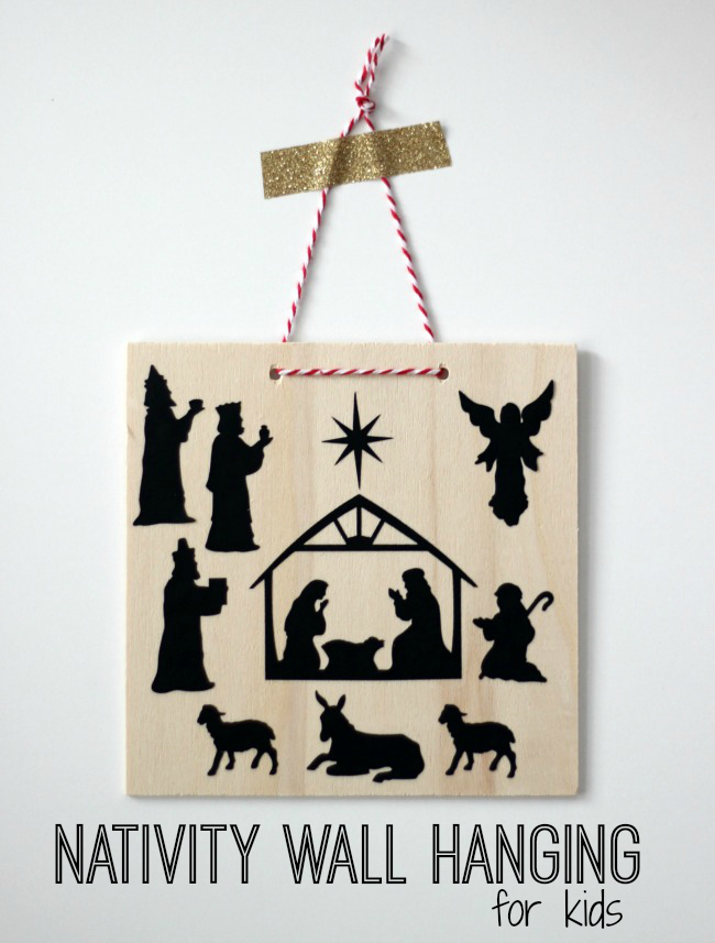 wooden nativity wall hanging on wall