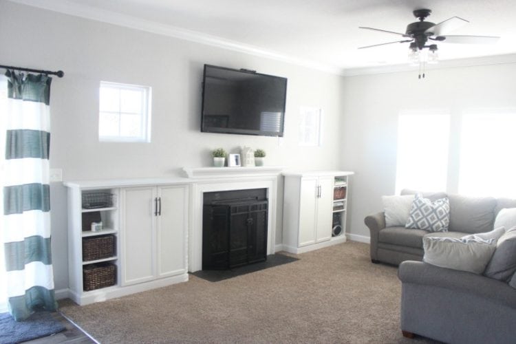 Organize your living room and make built ins for books, toys, and electronics with IKEA bookcases! Add trim, doors, hardware, and a top for a custom look.