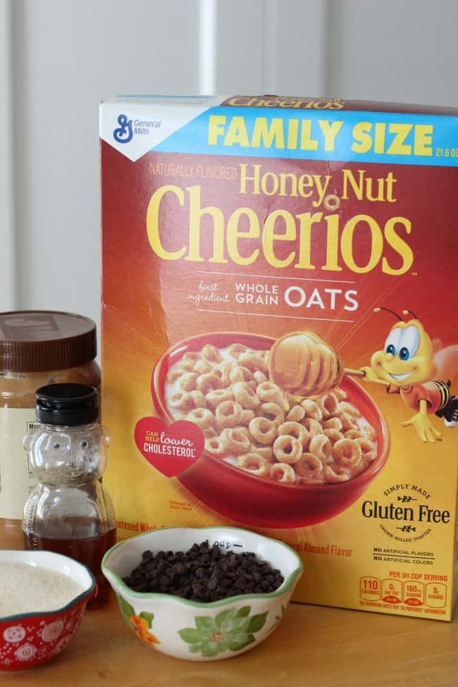 Peanut Butter Cheerio Bars! A delicious after school snack made with peanut butter, honey, a bit of sugar, and Honey Nut Cheerios™! Sprinkle with mini chocolate chips if you're feeling crazy.