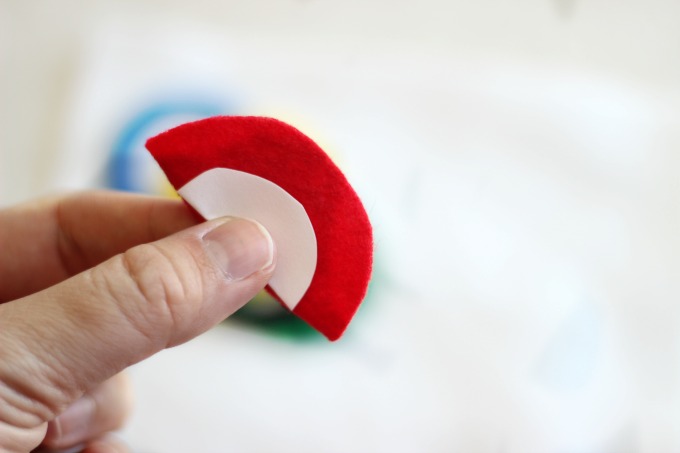 red felt circle folded in half with template