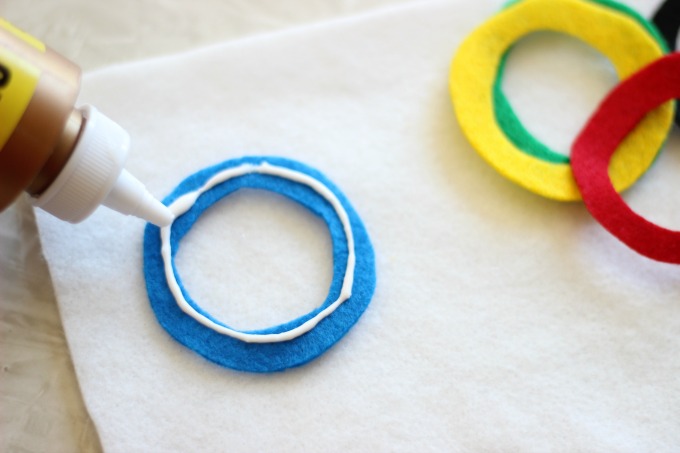 white glue on blue olympic ring