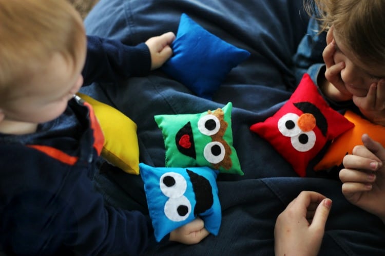 toddler playing with sesame street characters