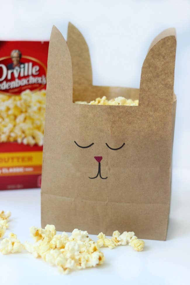 Turn paper lunch sacks into bunny treat bags with just a few snips of the scissors. A quick and easy way to make your next movie night even more fun!