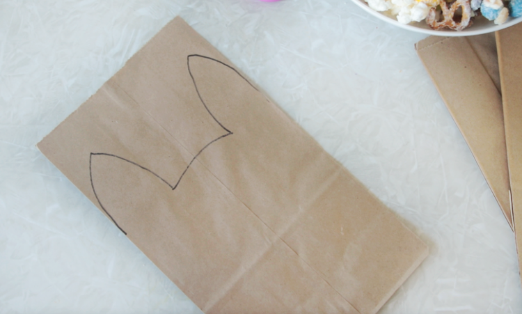 brown lunch sack with bunny outline drawn on front