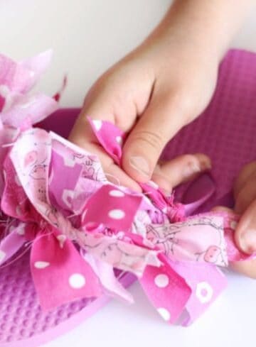 pink flip flop with fabric strips tied on
