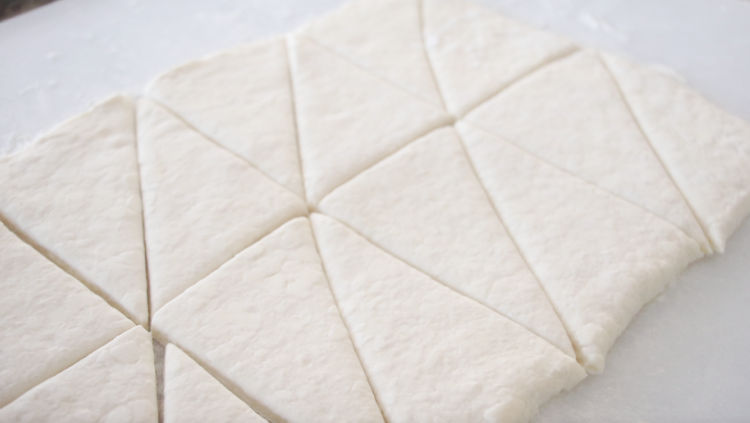 croissant dough cut into triangles