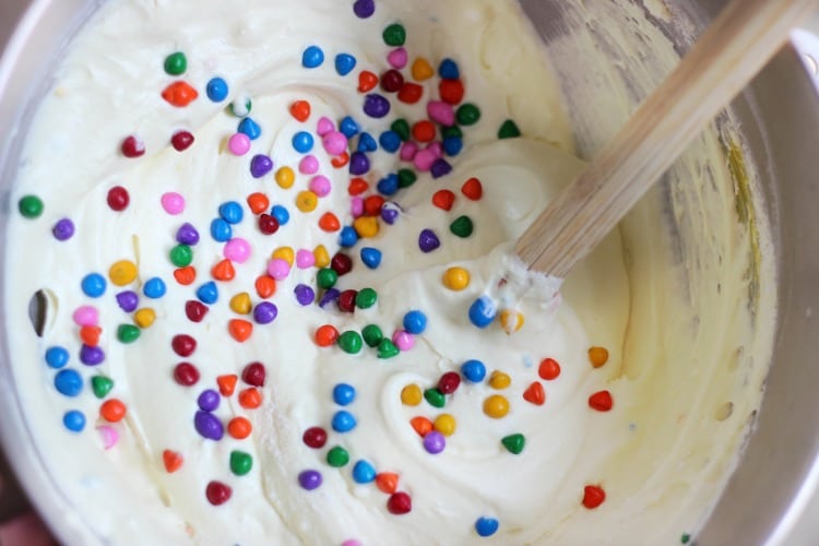 Cake batter ice cream is absolutely delicious and this no churn variety comes together in just minutes. Loaded with sprinkles it is the perfect ice cream for any celebration!