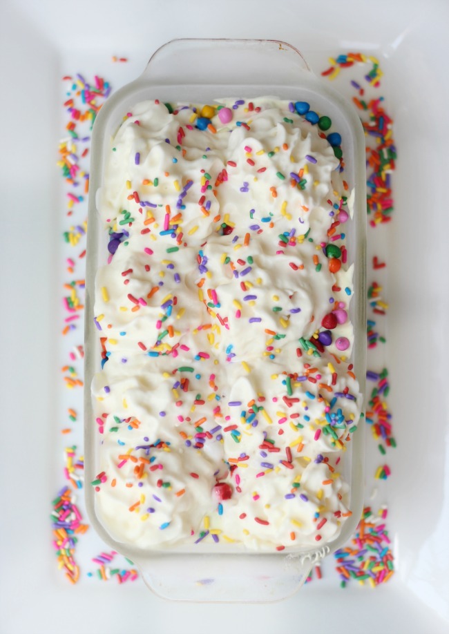 Cake batter ice cream is absolutely delicious and this no churn variety comes together in just minutes. Loaded with sprinkles it is the perfect ice cream for any celebration!